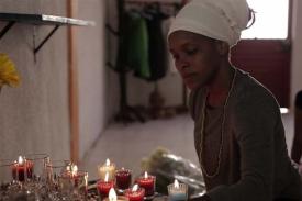 still film from Negra - woman lighting candles